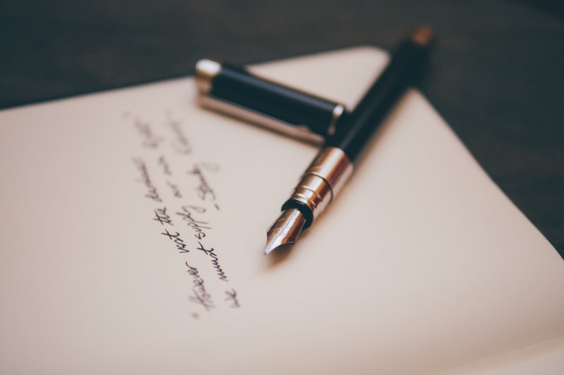 A fountain pen on a plain surface