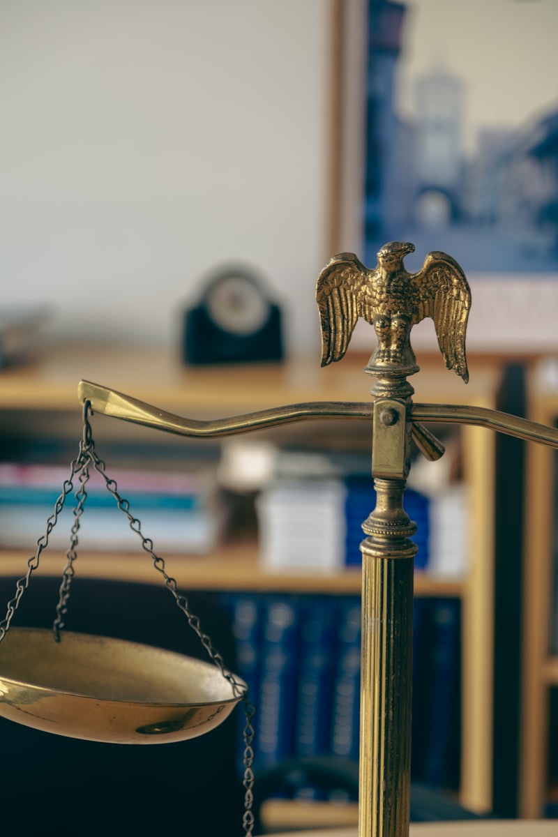 A brass balance scale surmounted by an eagle